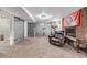 Finished basement area featuring exercise equipment, a fireplace, and comfortable seating for relaxing and entertainment at 2291 W 54Th Ave, Denver, CO 80221