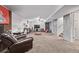 Finished basement with a red recliner and stairs to the upper level at 2291 W 54Th Ave, Denver, CO 80221