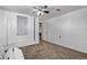Bedroom with white built-in shelving, carpet, a ceiling fan and neutral colors at 2291 W 54Th Ave, Denver, CO 80221