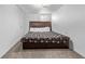Cozy bedroom featuring a comfortable bed, drawers, and soft carpeting creating a welcoming and relaxing atmosphere at 2291 W 54Th Ave, Denver, CO 80221