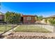 A well-kept house has a neat lawn, fenced yard, and inviting curb appeal at 2291 W 54Th Ave, Denver, CO 80221