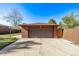 Detached garage with a covered patio and driveway, perfect for parking at 2291 W 54Th Ave, Denver, CO 80221