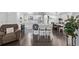 Modern kitchen with stainless steel appliances, a highchair, and stylish island seating at 2291 W 54Th Ave, Denver, CO 80221