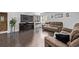 Inviting living room with a fireplace, comfortable seating, and natural light at 2291 W 54Th Ave, Denver, CO 80221