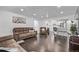 Bright living room featuring hardwood floors and a seamless open-concept design at 2291 W 54Th Ave, Denver, CO 80221