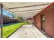 Covered patio overlooking the backyard, with space for seating and entertaining at 2291 W 54Th Ave, Denver, CO 80221