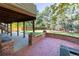 Backyard patio and lush lawn, framed by mature trees, offering outdoor space at 8812 Blue Mountain Pl, Highlands Ranch, CO 80126