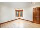 Bedroom featuring hardwood floors and multiple windows at 8812 Blue Mountain Pl, Highlands Ranch, CO 80126