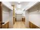 Walk-in closet featuring built-in shelving and wooden accents at 8812 Blue Mountain Pl, Highlands Ranch, CO 80126