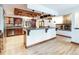 Spacious kitchen with a large island, stainless steel appliances, custom cabinets and a coffered wood ceiling at 8812 Blue Mountain Pl, Highlands Ranch, CO 80126