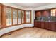 Bright eat-in kitchen area featuring a bay window with wood shutters and matching cabinetry at 8812 Blue Mountain Pl, Highlands Ranch, CO 80126