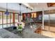 Kitchen showcasing granite countertops, a stainless steel refrigerator, and wooden cabinets at 8812 Blue Mountain Pl, Highlands Ranch, CO 80126