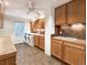 Convenient laundry room featuring a sink, countertops, tile backsplash and ample cabinet space at 8812 Blue Mountain Pl, Highlands Ranch, CO 80126