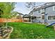 Enjoy the private fenced yard with mature trees and a covered patio, ideal for relaxation at 14194 W Amherst Ave, Lakewood, CO 80228