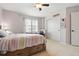 Bedroom with carpet, a ceiling fan, large closet and natural light from the window at 14194 W Amherst Ave, Lakewood, CO 80228