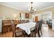 Inviting dining room with hardwood floors, chandelier, and view of the entry at 14194 W Amherst Ave, Lakewood, CO 80228