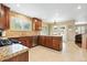 Bright kitchen features granite countertops, stainless steel appliances and tile flooring at 14194 W Amherst Ave, Lakewood, CO 80228