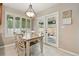 Eat-in kitchen area features a table with seating for four, with access to the outdoor patio at 14194 W Amherst Ave, Lakewood, CO 80228