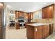 Well-equipped kitchen with granite countertops, stainless steel appliances, and access to the dining room at 14194 W Amherst Ave, Lakewood, CO 80228