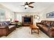 The living room includes hardwood floors, a ceiling fan, and comfortable seating at 14194 W Amherst Ave, Lakewood, CO 80228