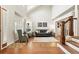 Spacious living room with hardwood floors, high ceilings, and plenty of natural light from large windows at 14194 W Amherst Ave, Lakewood, CO 80228