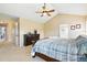 Spacious main bedroom features a ceiling fan and ample natural light at 14194 W Amherst Ave, Lakewood, CO 80228