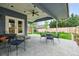 Spacious patio leads to grassy backyard, perfect for outdoor relaxation and entertaining at 14194 W Amherst Ave, Lakewood, CO 80228