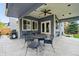 Inviting covered patio with outdoor seating and access to backyard entertainment space at 14194 W Amherst Ave, Lakewood, CO 80228