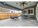 Enjoy this covered outdoor patio with ceiling fan, concrete pavers, and backyard access at 14194 W Amherst Ave, Lakewood, CO 80228