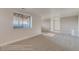 Finished basement area with a window and neutral-toned carpet at 881 W 128Th Pl, Westminster, CO 80234