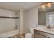 Bathroom with white tile, bathtub, shower combination, and vanity at 881 W 128Th Pl, Westminster, CO 80234