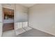 Carpeted bedroom with a sliding-door closet and adjacent kitchen view at 881 W 128Th Pl, Westminster, CO 80234