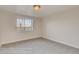 Bright bedroom with a large window providing natural light and neighborhood views at 881 W 128Th Pl, Westminster, CO 80234