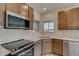 Close up shot of the kitchen featuring stainless steel appliances and bright countertops at 881 W 128Th Pl, Westminster, CO 80234