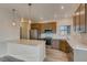Modern kitchen with stainless steel appliances, countertops, and ample cabinet space at 881 W 128Th Pl, Westminster, CO 80234