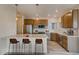 Open kitchen design with modern bar stool seating, stainless steel appliances and ample counter space at 881 W 128Th Pl, Westminster, CO 80234
