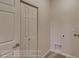 Bright laundry area featuring tile flooring and access panel for the dryer exhaust and utility connections at 881 W 128Th Pl, Westminster, CO 80234