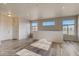 A well-lit, modern living room with large windows and sleek flooring at 881 W 128Th Pl, Westminster, CO 80234