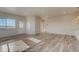 Spacious living room with a well-lit interior, light wood flooring, and view of the outdoors at 881 W 128Th Pl, Westminster, CO 80234