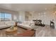 Bright, open-concept living room and dining area with stylish furnishings and ample natural light at 881 W 128Th Pl, Westminster, CO 80234