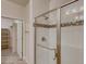 Modern bathroom with a tiled shower, glass door, and decorative accent tile at 881 W 128Th Pl, Westminster, CO 80234