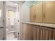 Hall bathroom with a vanity that features shaker cabinets and white tiled floors at 4547 W 37Th Ave # 1, Denver, CO 80212