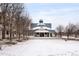 Community pavilion on a snowy field with mature trees on a cold winter day at 4547 W 37Th Ave # 1, Denver, CO 80212