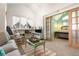 Living room with view into the ensuite bedroom, featuring bright natural light and vaulted ceilings at 4547 W 37Th Ave # 1, Denver, CO 80212