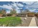 A spacious yard is perfect for entertaining with a walkway to the house and patio at 273 S 13Th Ave, Brighton, CO 80601