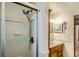 Clean bathroom design featuring a vanity with a mirror and a walk-in shower at 273 S 13Th Ave, Brighton, CO 80601