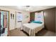 Bedroom with a queen-sized bed, a ceiling fan and windows for natural lighting at 273 S 13Th Ave, Brighton, CO 80601