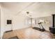 Spacious bonus room with tile floors, large windows, and a modern treadmill at 273 S 13Th Ave, Brighton, CO 80601