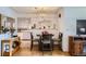Cozy dining area adjacent to kitchen with a modern chandelier and stylish decor at 273 S 13Th Ave, Brighton, CO 80601