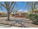 A charming single-story home with mature trees and a well-manicured front yard at 273 S 13Th Ave, Brighton, CO 80601